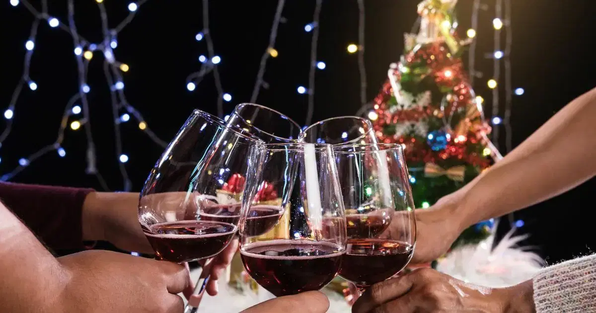 0 midsection of friends toasting wineglasses during christmas.jpg