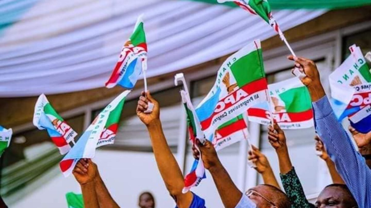 apc members holding party flag 1200x675 1